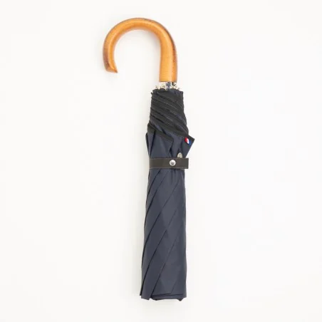 Navy blue folding umbrella, closed