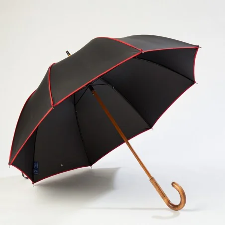 Schwarzer Stockschirm mit rotem Rand, vorne zu öffnen