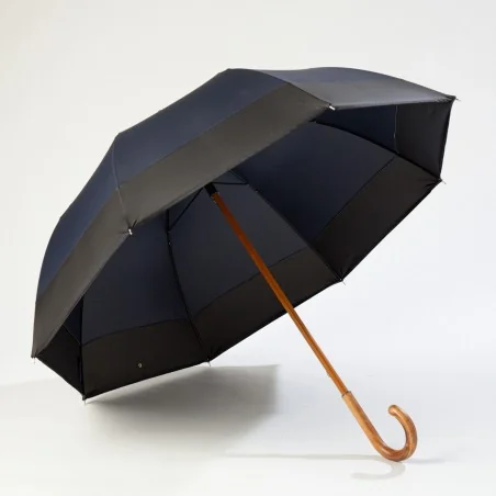 large navy blue umbrella, open on one side