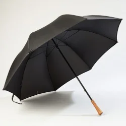 Black golf umbrella, open at the front