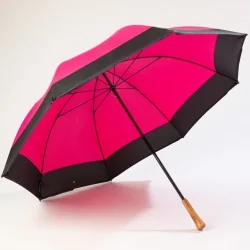 Pink golf umbrella, open at the front