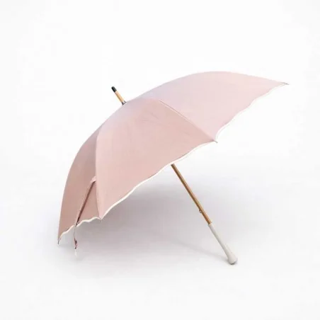 Pink parasol with beige bias anti-UV wave pattern, side view