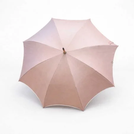 Chic pink UV-protective parasol with beige trim, viewed from the front