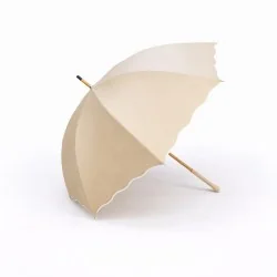 Beige slanted anti-UV wave-patterned champagne parasol, side view