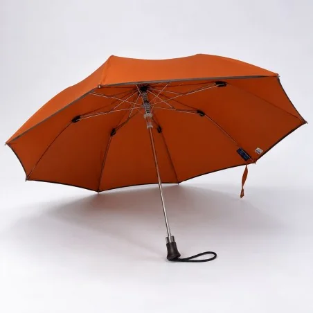 open terracotta folding umbrella seen from the front