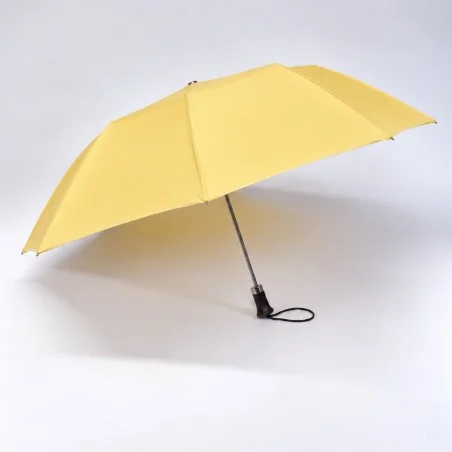 open yellow folding umbrella seen from the front