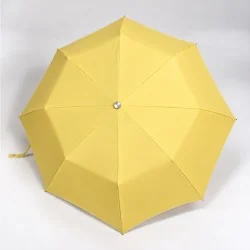 open yellow folding umbrella